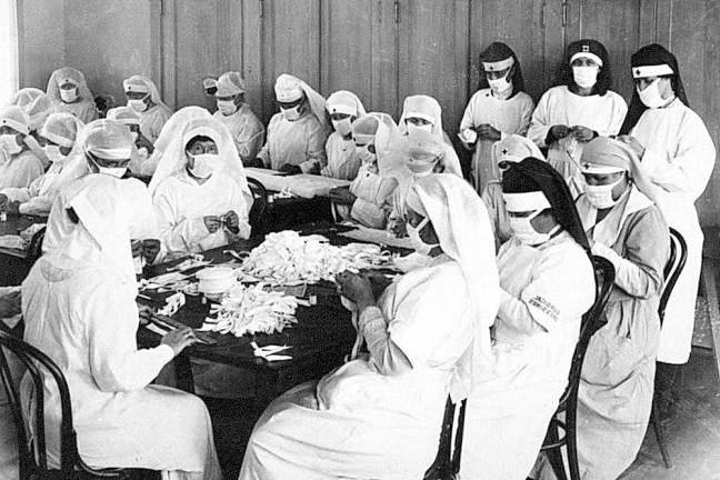 But we survived! Volunteer caregivers from the American Red Cross during the Spanish Flu epidemic (1918). (CO0-Creative Commons)