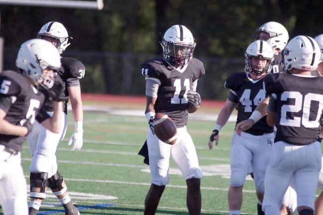 Delaware Valley defensive back Harlem Cook holds the ball after intercepting it in the second quarter.