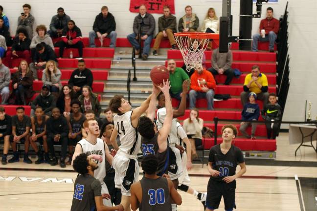 DV Warriors defeat Valley Central Vikings in holiday tournament Hands reach for the ball during a rebound. (Photo by George Leroy Hunter)