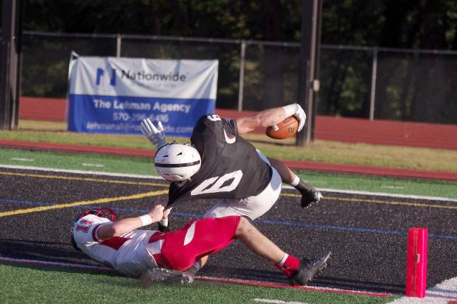 After a long gain Delaware Valley ball carrier Jason Henderson is brought down by North Pocono defender Ryan Dolphin just short of the goal line in the third quarter. Henderson scored two rushing touchdowns.