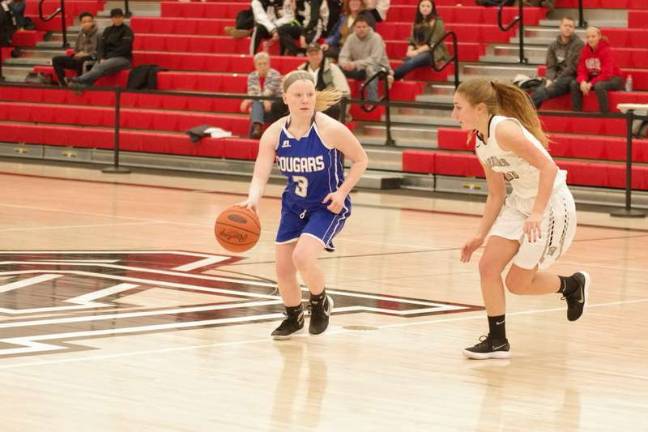 Lady Cougars top Lady Warriors in holiday basketball tourney Kittatinny's Phoebe Livingston dribbles the ball while covered by Delaware Valley's Shelby Brittain. Livingston scored 6 points. (Photo by George Leroy Hunter)