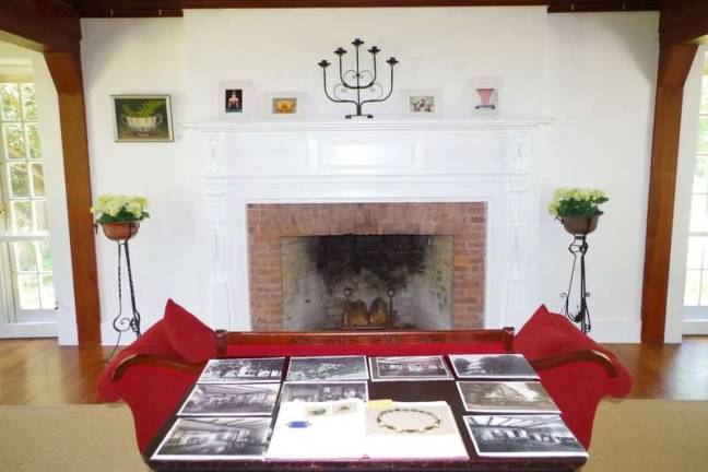 The living room in the main house, where visitors browsed old photos showing how the residence used to look and a book depicting Zimmermann's jewelry (Photo by George Leroy Hunter)