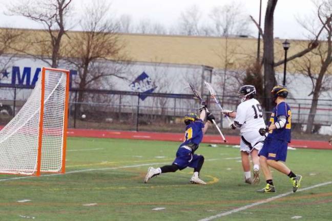 Delaware Valley Warriors take down Pine Bush Bushmen in lacrosse The ball sails towards the goal post after being tossed by Delaware Valley's Riley Van Wie (19)