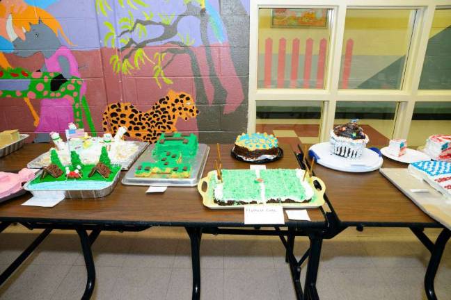 Cub Scouts graduate to Boy Scouts Photo courtesy: Douglas Crane Cakes were on display for judges to vote as Cub Scout Pack 1003 held its annual Father/Son Cake Decorating Contest at the Blue and Gold Banquet.