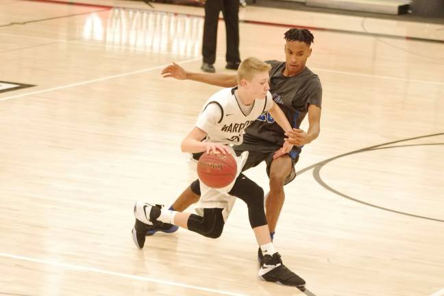 DV Warriors defeat Valley Central Vikings in holiday tournament Delaware Valley's Blake Gearhart dribbles the ball past Valley Central's Jordan Hickman. Gearhart scored a game-high 15 points. Gearhart was named tournament MVP. (Photo by George Leroy Hunter)