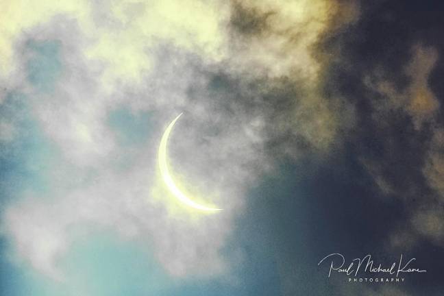 Residents gather to view partial solar eclipse The partial solar eclipse. (Photo by Paul Michael Kane)