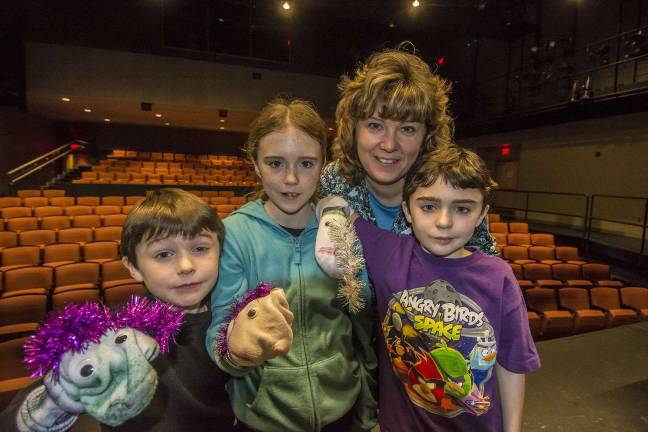 Sock puppet fun (L-R) Jason Cahill, 8, of Vernon, sister Emma, 12, mom Meg Gummere, and brother Patrick 10.
