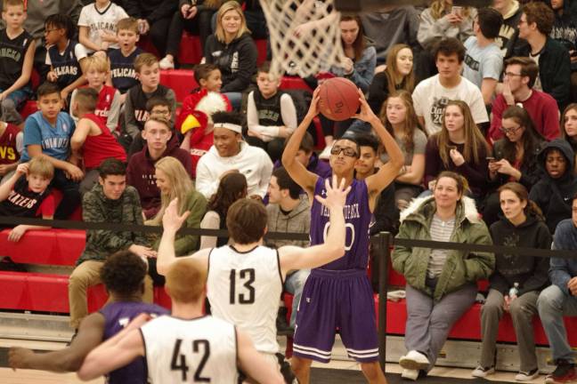 Delaware Valley Warriors hold off Wallenpaupack Buckhorns Wallenpaupack's Izaiah Santiago holds the ball as he looks for an open teammate to pass to. (Photo by George Leroy Hunter)