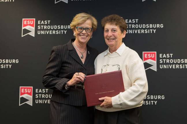 ESU President Marcia G. Welsh, Ph.D. presents Elaine Rogers, D.Ed., distinguished professor of recreation services management, with a certificate of recognition for her 40 years of service to ESU. (Photo provided)