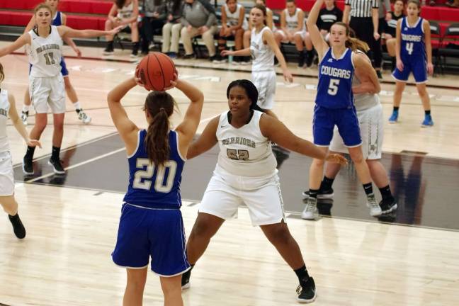 Lady Cougars top Lady Warriors in holiday basketball tourney Kittatinny's Kelly Insalaco holds the ball while covered by Delaware Valley's Elizabeth Bobo. (Photo by George Leroy Hunter)