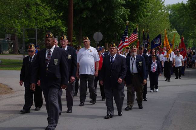 Remembering those who served American Legion Post 139 Post Commander Gene Hudson leads marchers along the parade route.