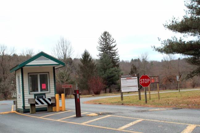 <b>Warnings about the lack of lifeguards are also posted on the fee booth as visitors enter the park. (File photo by Pamela Chergotis)</b>