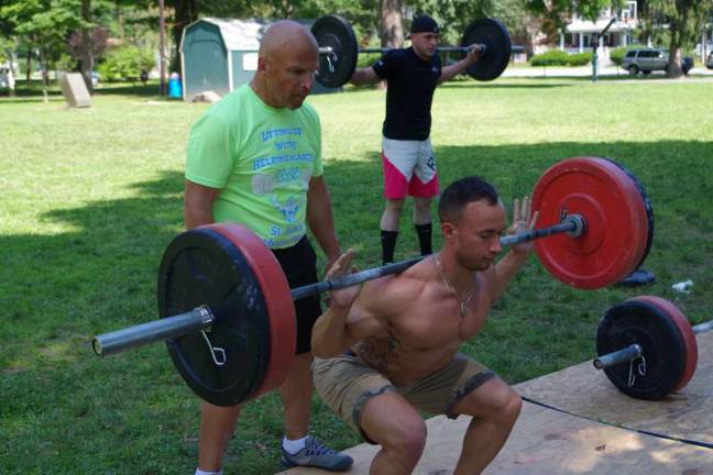A day of heavy lifting Joe Accardi of Milford spots Jonathan Mascia of Dingmans Ferry.