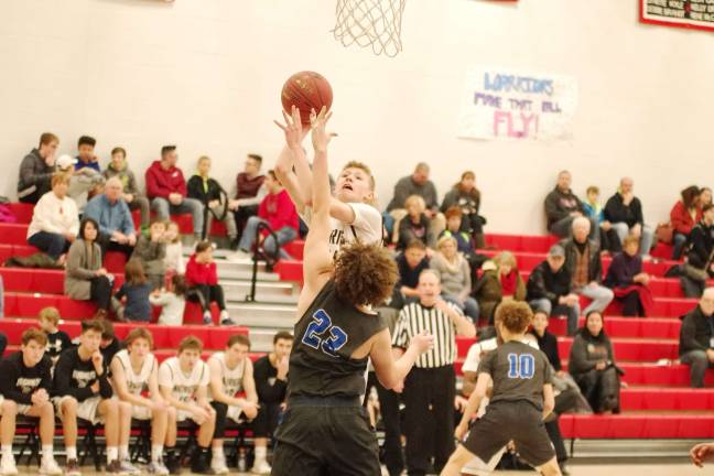 DV Warriors defeat Valley Central Vikings in holiday tournament Delaware Valley's Blake Gearhart takes the ball towards the hoop and is fouled by Valley Central's Noah Fernandez in the fourth period. Gearhart scored a game-high 15 points. Gearhart was named tournament MVP. (Photo by George Leroy Hunter)