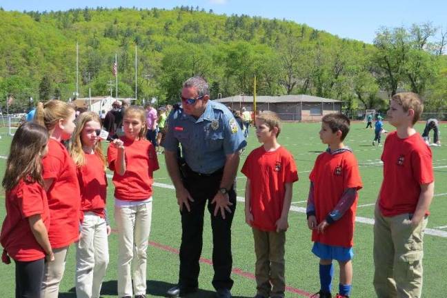 Special Olympics comes to DV Officer Marty Gaughan was asked about providing security at the Special Olympics. He said everything was fine and running smoothly. From left: Scarlett Weir, Mia Purdon, Ryan O’Connor, Adrianna Buchanan, Officer Gaughan, Nixon Kameen, Ty Bates, and Jason King.