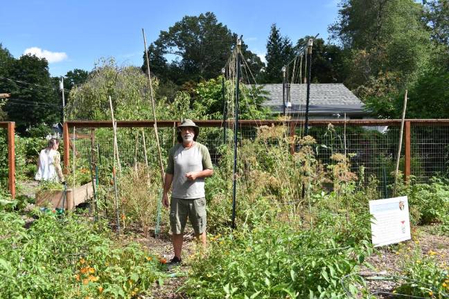 Local gardens win props for their crops at Kitchen Garden Tour Chad Pilieri, of Greenwood Lake Common Ground Community Garden, shows attendees around. Photo by Becca Tucker.