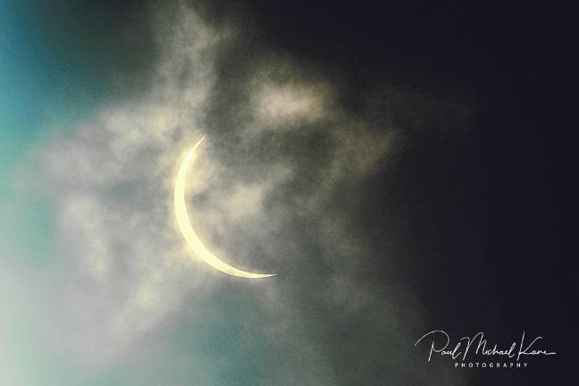 Residents gather to view partial solar eclipse The partial solar eclipse. (Photo by Paul Michael Kane)