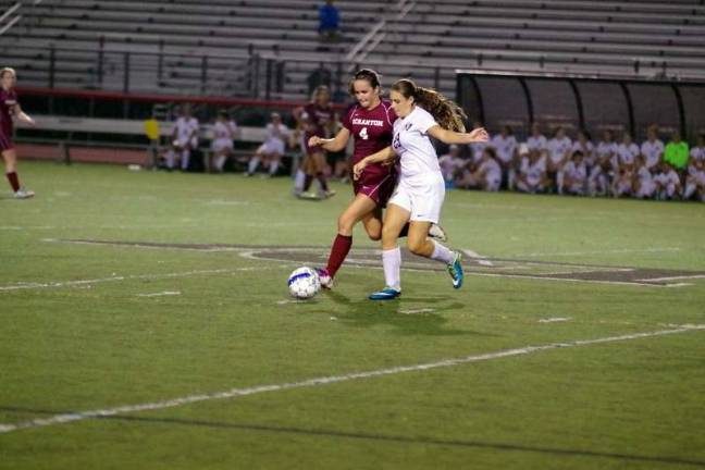 Delaware Valley Lady Warriors rout Scranton Lady Knights in soccer A Scranton Knight and a Delaware Valley Warrior battle for control of the ball