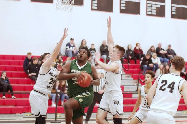 Wyoming Area's Sammy Solomon takes the ball towards the hoop in the first half. Solomon scored 11 points.