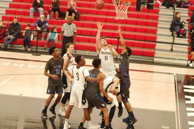 DV Warriors defeat Valley Central Vikings in holiday tournament Delaware Valley's Zach Klapak (11) tosses the ball towards the hoop. Klapak scored nine points and was named to the All-Tournament team. (Photo by George Leroy Hunter)