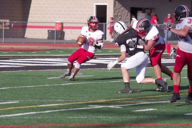 North Pocono High School quarterback Michael Scutt drops back to pass the ball in the first quarter. Scutt threw one touchdown pass.