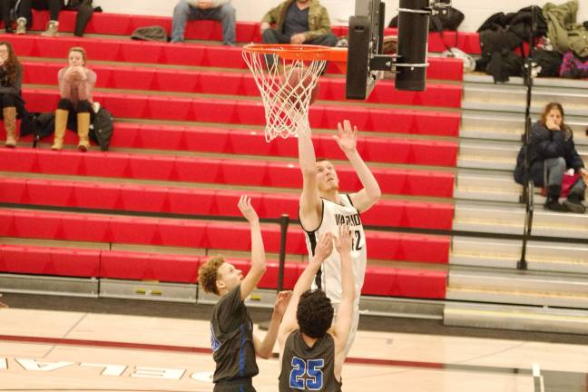 DV Warriors defeat Valley Central Vikings in holiday tournament Delaware Valley's Matt Campbell lifts the ball high during a shot in the third period. Campbell scored four points. (Photo by George Leroy Hunter)