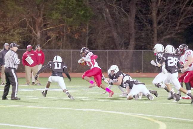 Williamsport ball carrier Lajear Whaley is on the move in the first half.