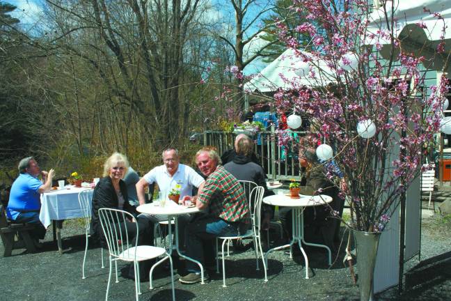 Waterwheel Café, at 25, savors the taste of success Guests enjoy some of the mild weather that's been in short supply so far this spring (Photo by Linda Fields)