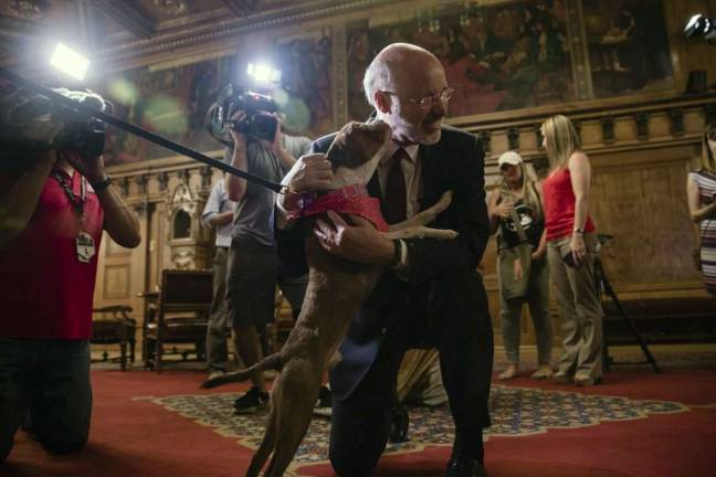 New law makes tethering dogs in frigid weather a felony Governor Wolf gets kisses from Libre, the inspiration for the new humane law, after signing the bill last year (Photo: Governor Wolf)