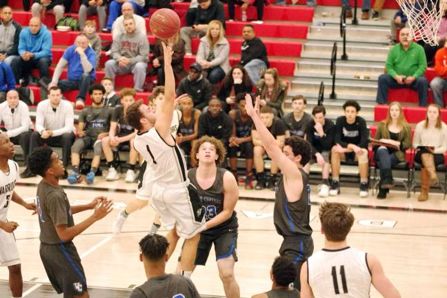 DV Warriors defeat Valley Central Vikings in holiday tournament Delaware Valley's Dylan Kelly takes the ball towards the hoop during a shot. Kelly scored three points. (Photo by George Leroy Hunter)