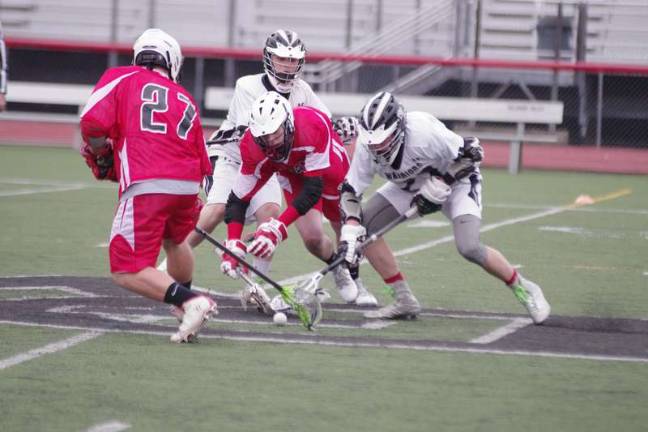 DV Warriors demolish North Pocono Delaware Valley Warriors and North Pocono Trojans battle for the ball in the middle of the field.