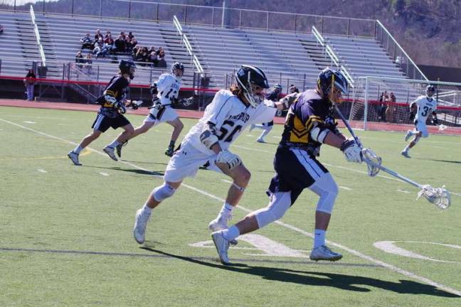 Vernon crushes DV in lacrosse Delaware Valley's Anton Mackey uses his stick to try to dislodge the ball away from Vernon's Jeff Sedlock. Sedlock scored four goals. (Photo by George Leroy Hunter)