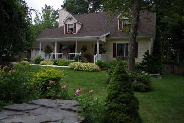 The house on Hemlock Cove has impeccable curb appeal. The owners do their own landscaping.