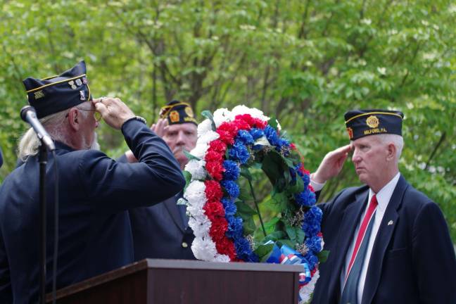 Remembering those who served Military veterans salute during wreath ceremony at the War Memorial on Broad Street in Milford.