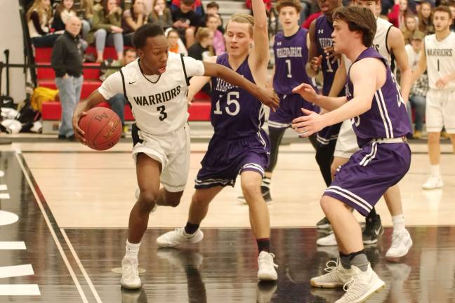 Delaware Valley Warriors hold off Wallenpaupack Buckhorns Delaware Valley's Hassan Keys maneuvers the ball on the court. Keys scored eleven points. (Photo by George Leroy Hunter)