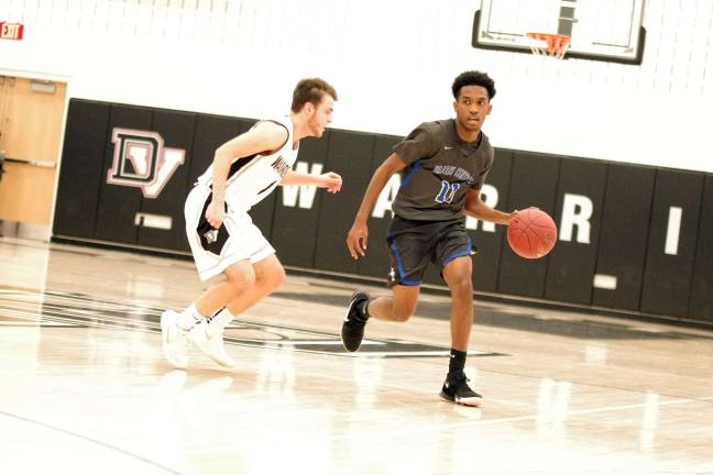 DV Warriors defeat Valley Central Vikings in holiday tournament Delaware Valley's Dylan Kelly covers Valley Central ball handler Kameron John. John scored three points. (Photo by George Leroy Hunter)