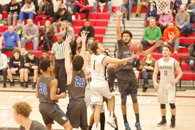 DV Warriors defeat Valley Central Vikings in holiday tournament Delaware Valley's Dylan Kelly takes the ball towards the hoop during a shot. Kelly scored three points. (Photo by George Leroy Hunter)