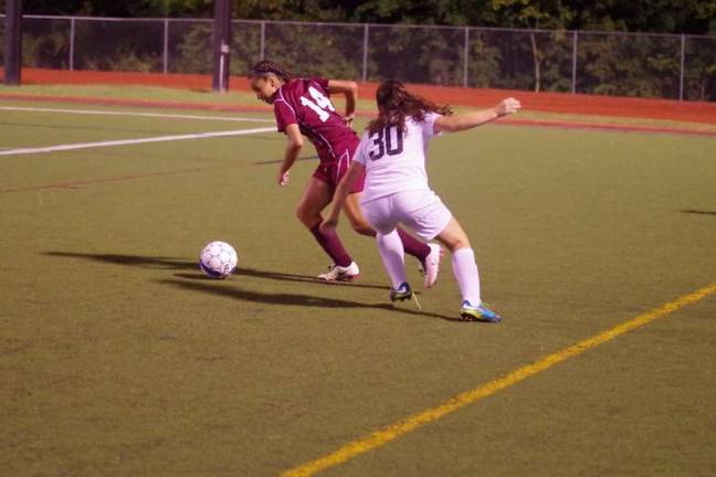 Delaware Valley Lady Warriors rout Scranton Lady Knights in soccer A Scranton Knight maneuvers the ball while being shadowed by a Delaware Valley Warrior