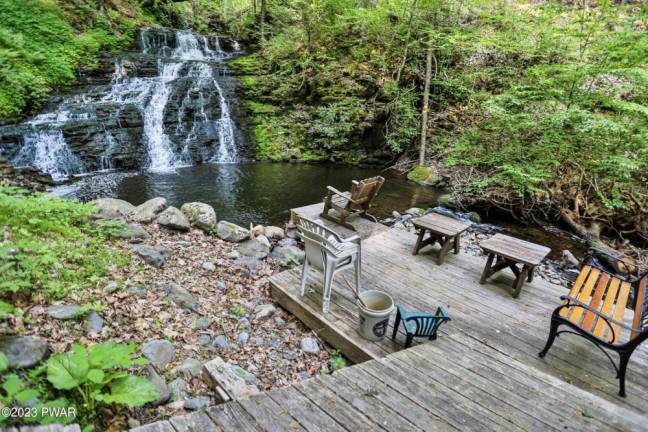 This custom log home is surrounded by nature