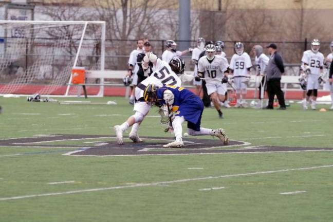 Delaware Valley Warriors take down Pine Bush Bushmen in lacrosse A Delaware Valley Warrior and a Pine Bush Bushman battle for control of the ball at the center of the field