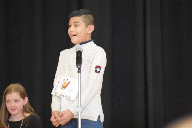 Fifth grader Eddie Arias after spelling the winning word, “knowingly,” besting fourth grader Mackenzie McAdam, who got tripped up on “shoddiest.”