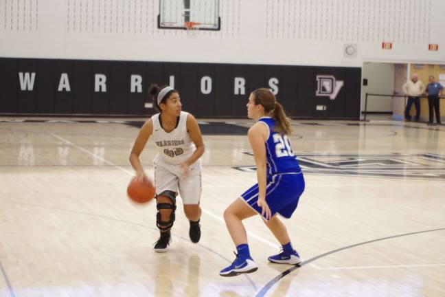 Lady Cougars top Lady Warriors in holiday basketball tourney Delaware Valley's Ciera Cavallaro is covered by Kittatinny's Kelly Insalaco. (Photo by George Leroy Hunter)
