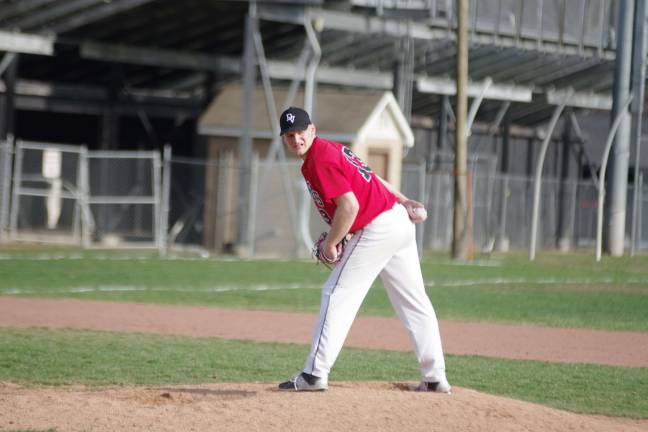 DVHS strikes out to Valley View Delaware Valley pitcher Jeff Hupfer glances towards first base.