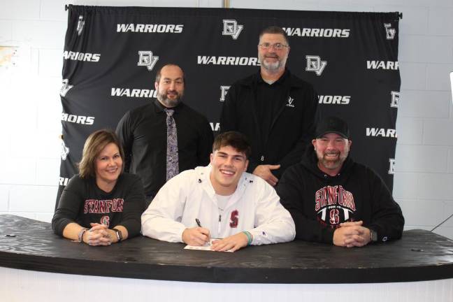 L-R Front: Karen Black, Aiden Black, and Rob Black. L-R Back: Head wrestling coach Lou DeLauro and head football coach Keith Olsommer.