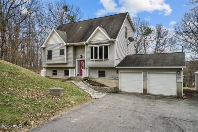 Move right into a roomy contemporary in the woods Move right into a roomy contemporary in the woods