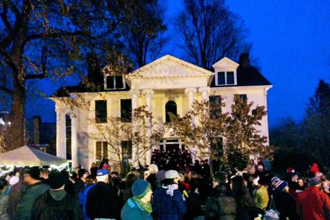Santa arrives, the tree lights up, and all is well in Milford At least 200 people came to the annual Milford tree lighting on Community House grounds (Photo by Anya Tikka)