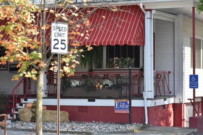 Emery signs outside the Bill Rosado-owned Tom Quick Inn (Photo by Becca Tucker)