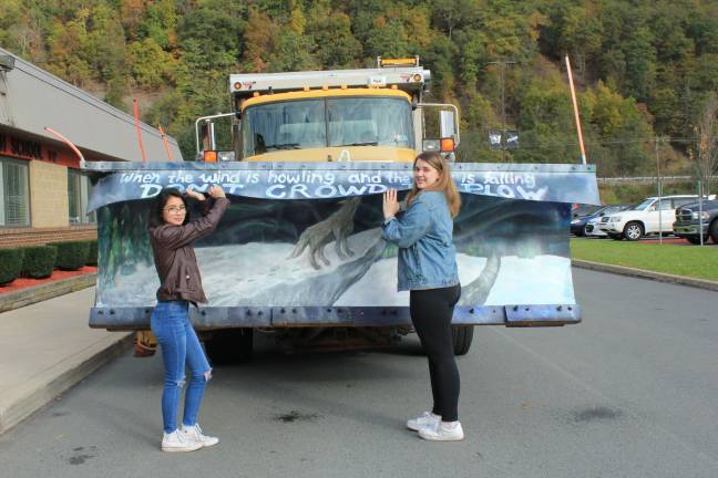 Paint the plow — but don't crowd it! Destiny Lourenco (left) and Adrianna Mojica at the great plow unveiling (Photo by Pamela Chergotis)
