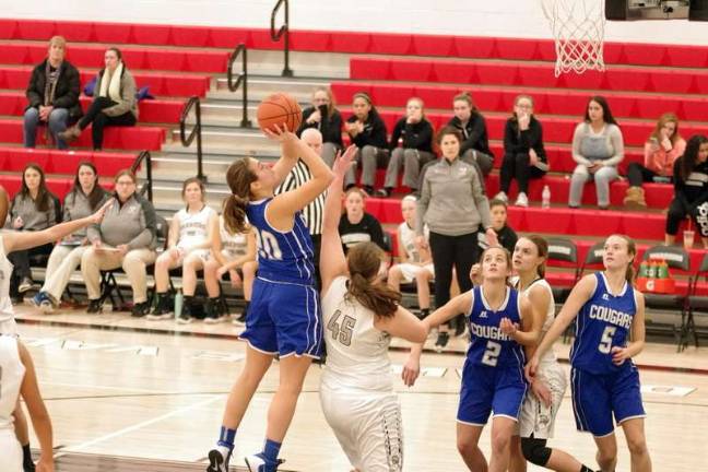 Lady Cougars top Lady Warriors in holiday basketball tourney Kittatinny's Kelly Insalaco aims the ball at the basket during a leaping shot attempt. Insalaco was named tournament MVP after leading Kittatinny with 21 points, scoring her 1,000th career point in the process. (Photo by George Leroy Hunter)