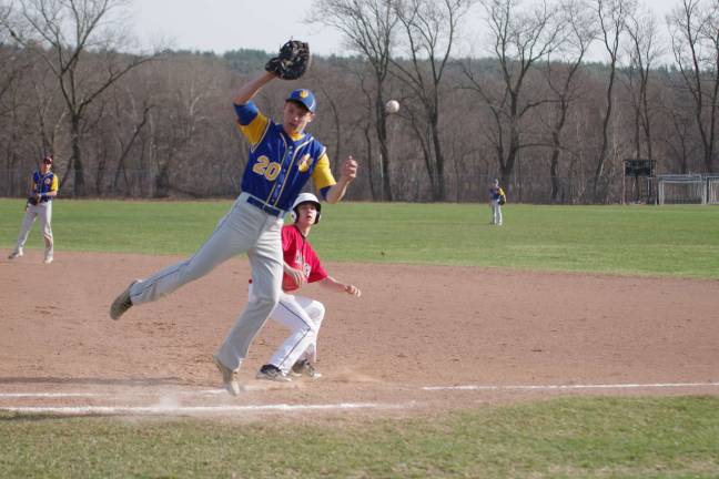 DVHS strikes out to Valley View The ball gets away from the Valley View first baseman allowing a Delaware Valley runner a chance to head to second base.